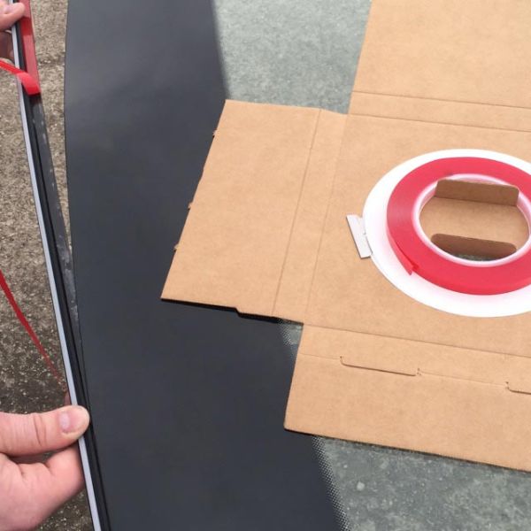 Marcy Attachment Tape being applied to auto glass