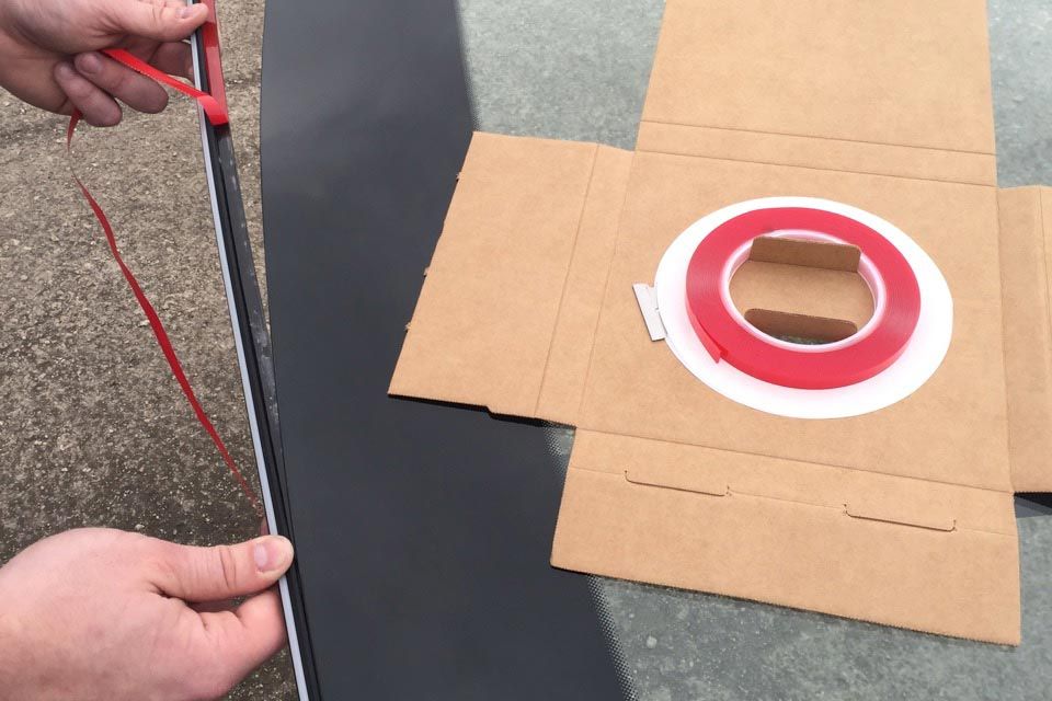 Marcy Attachment Tape being applied to auto glass