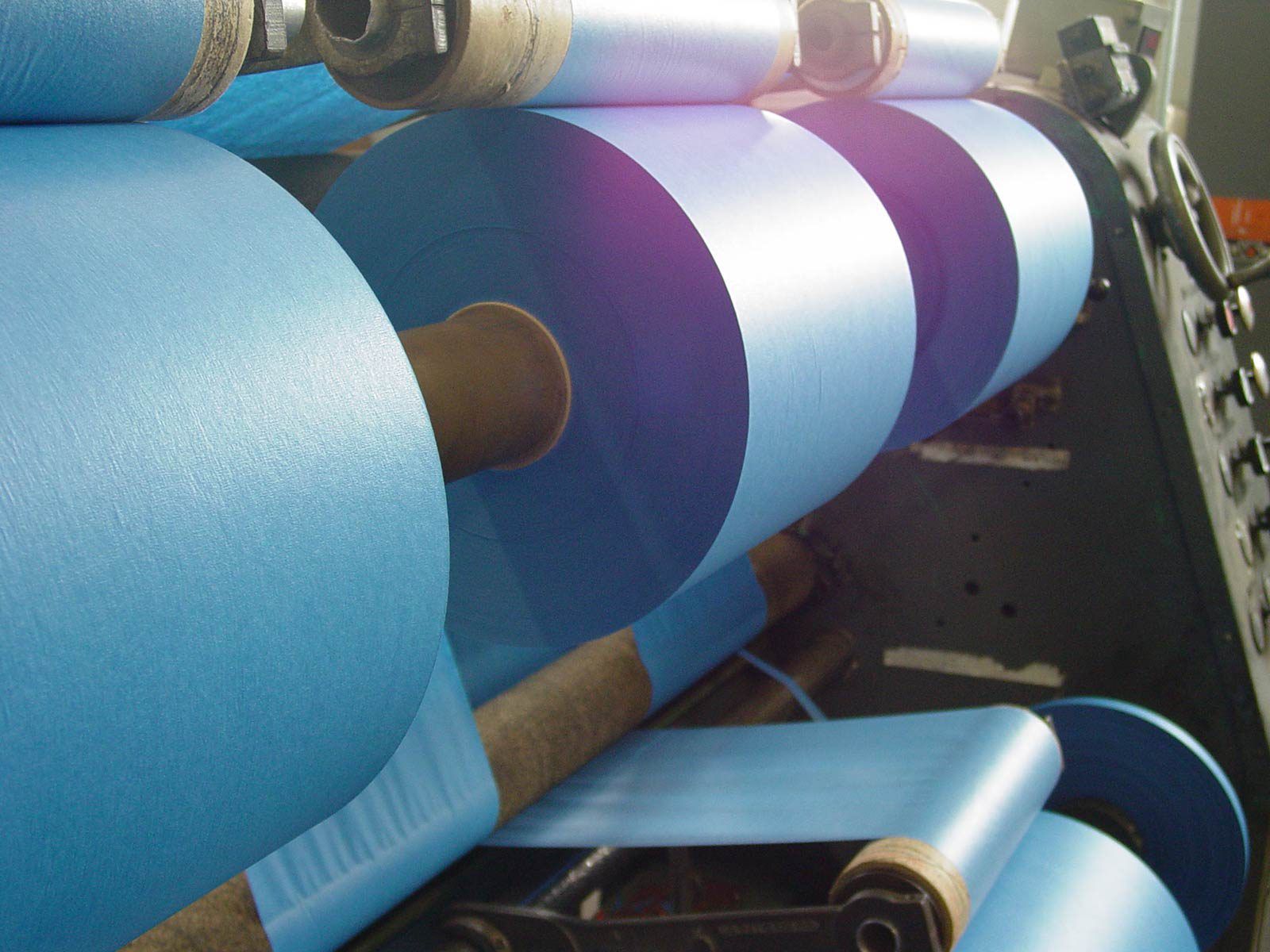 rolls of automotive tape on a machine